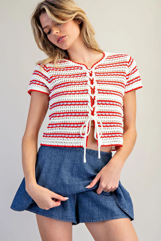 A mineral-washed denim skort with a smocked waistband, built-in shorts, and a flared A-line silhouette.