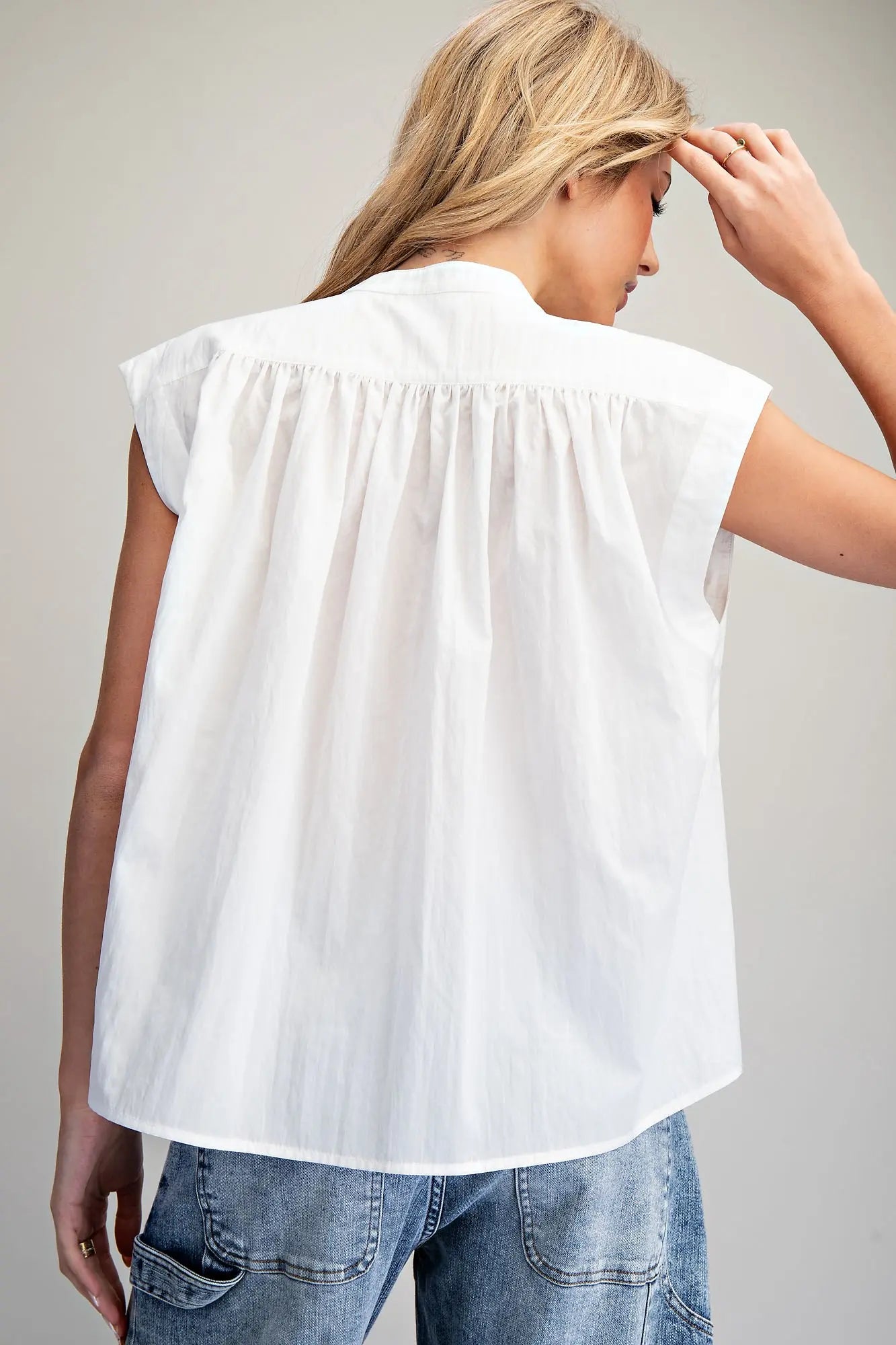 Split neck sleeveless blouse with pleated back detail