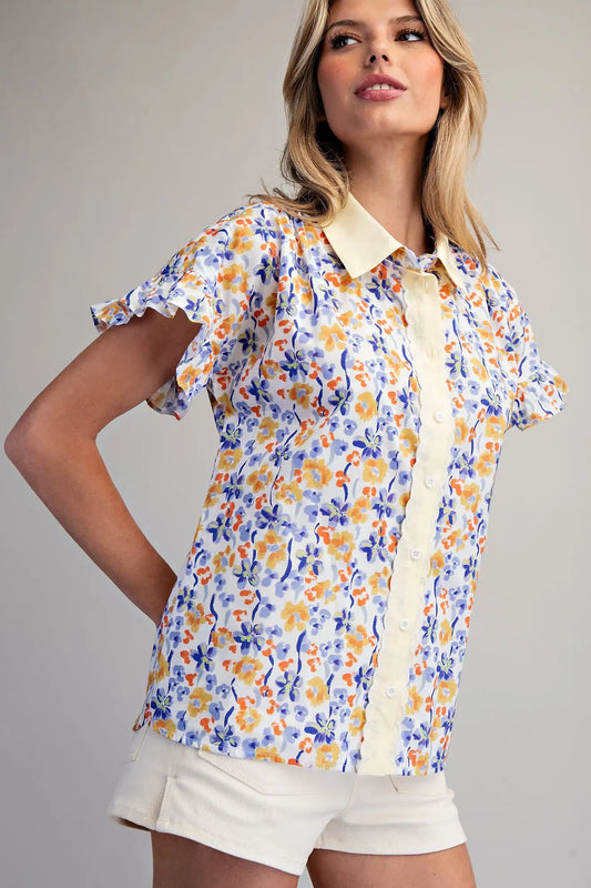 floral button-down blouse featuring flutter sleeves and delicate scalloped trim detailing