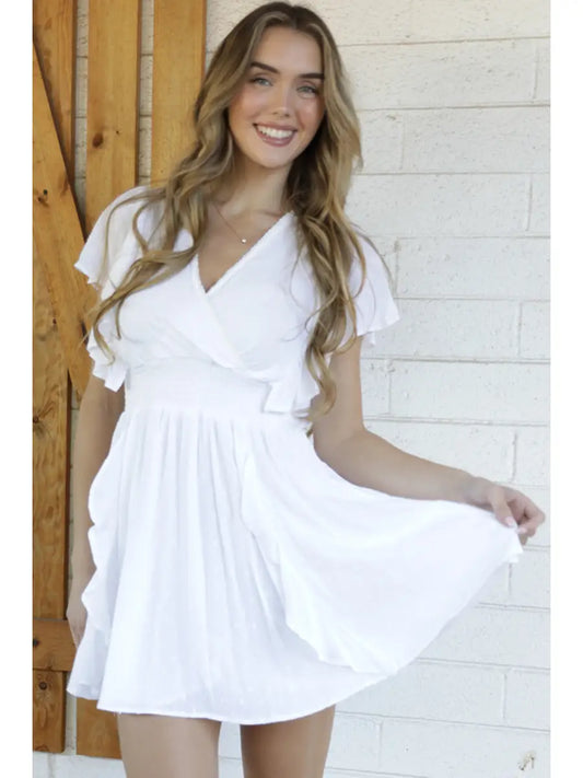 V-neck mini dress with Swiss dot texture and fit-and-flare silhouette