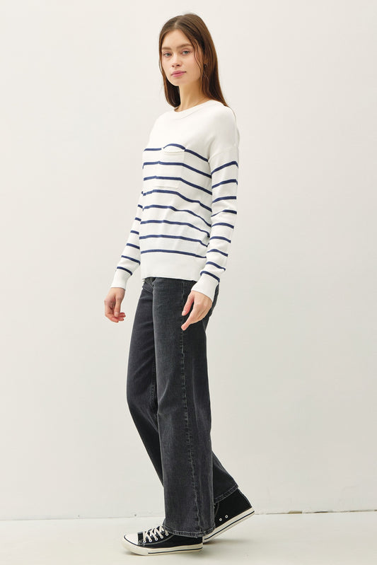 Lightweight striped sweater with round neckline and front pocket.