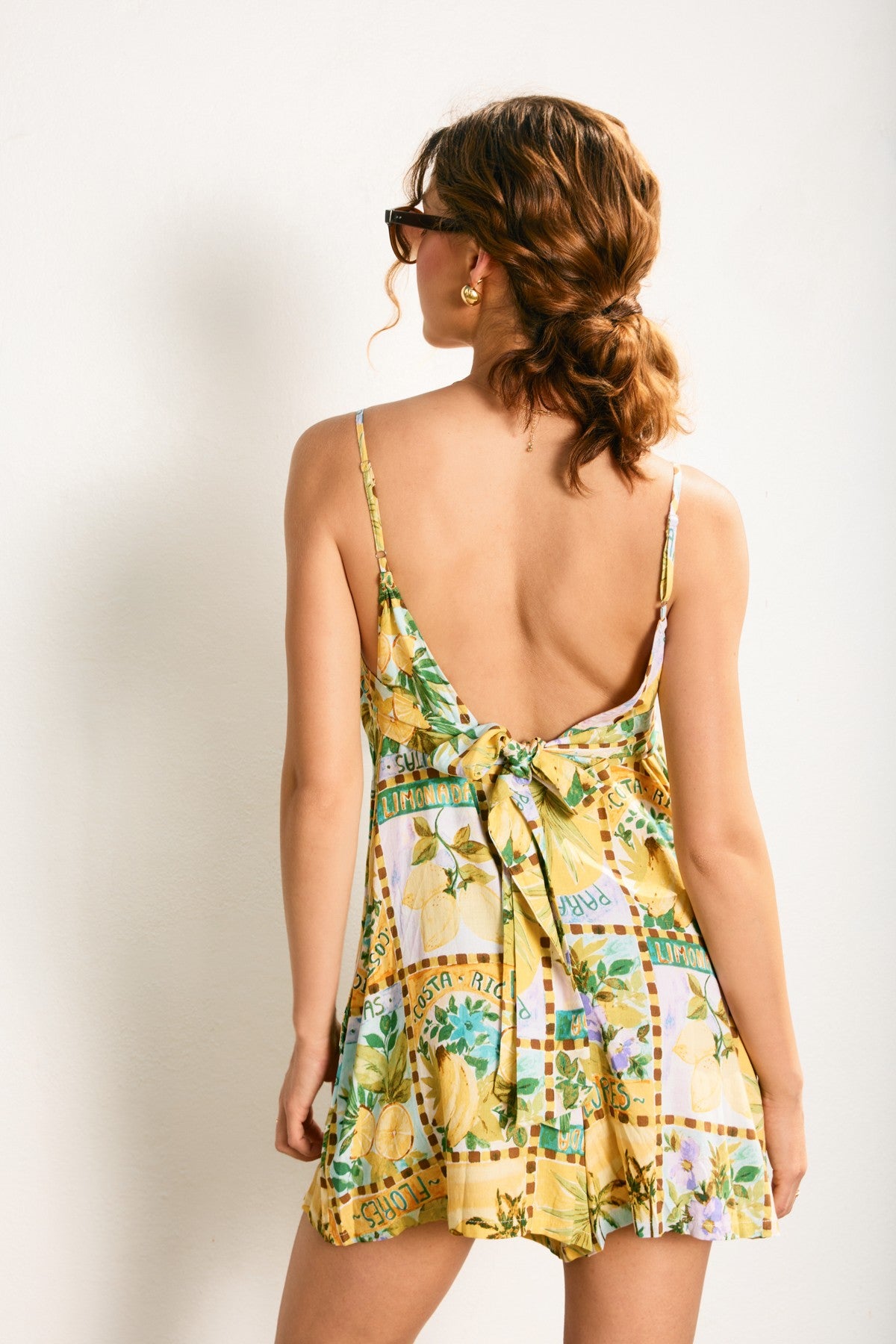 Vacation print open back romper with tie closure