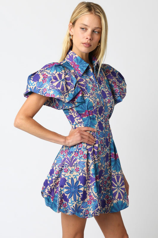 The Nola dress brings playful charm with its floral print, bubble hem, and flattering silhouette.