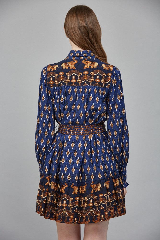 The Isla mini dress stuns with a high neck collar band, delicate ruffles, and an effortlessly feminine silhouette.