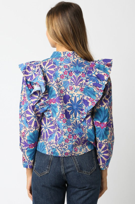 The Elowen Floral Ruffle Shirt blends effortless charm with timeless feminine details.