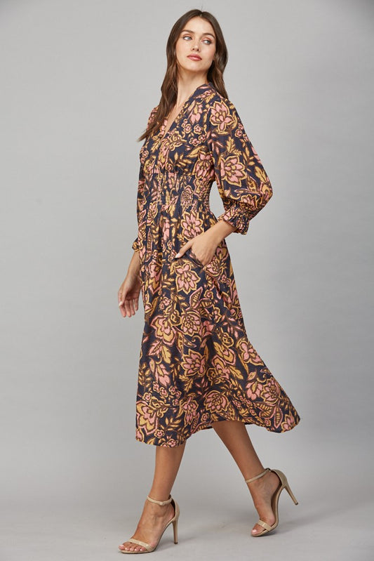 Floral print midi dress with gathered waist and front zip closure.