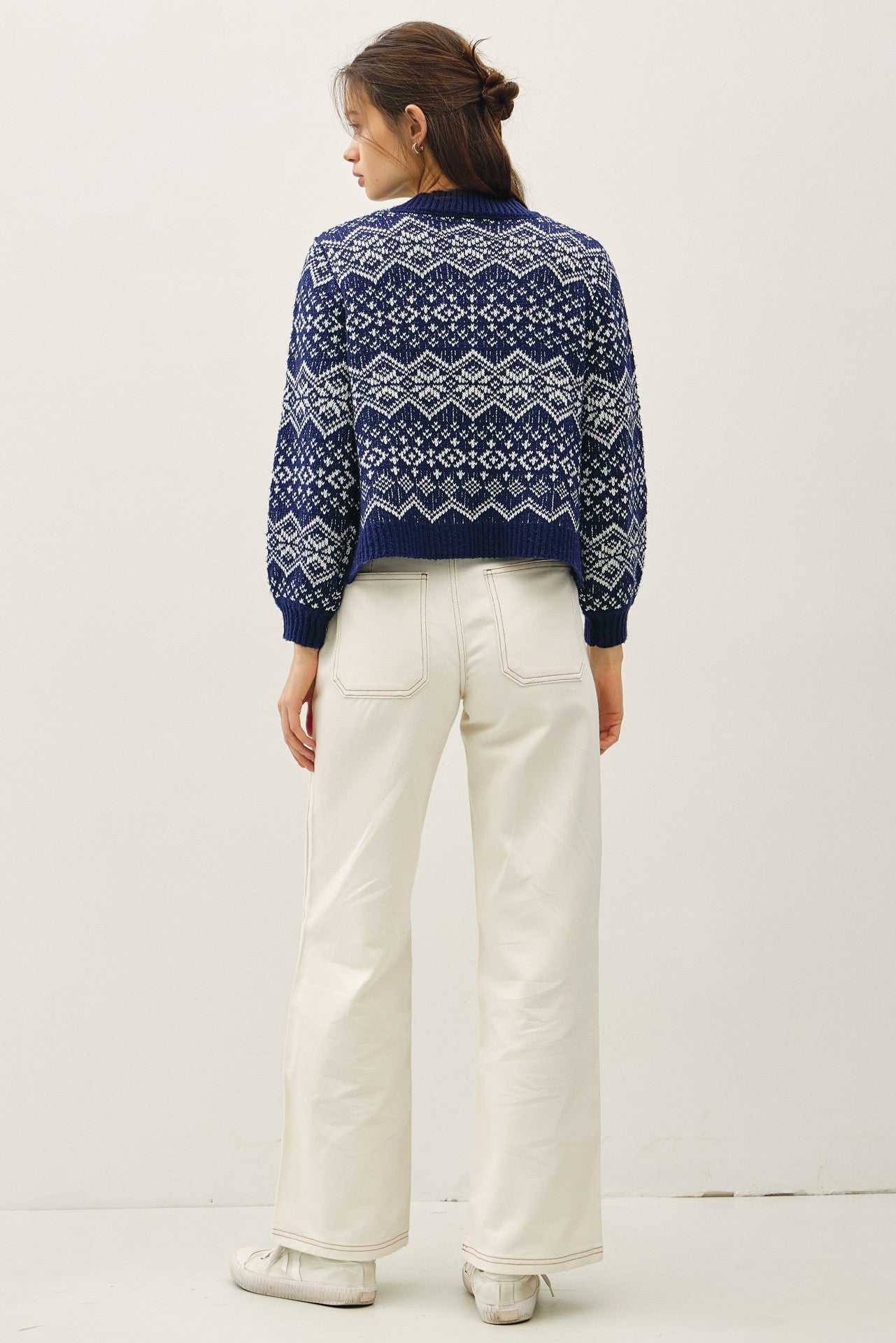 A timeless Fair Isle cardigan designed for cozy, classic holiday style.