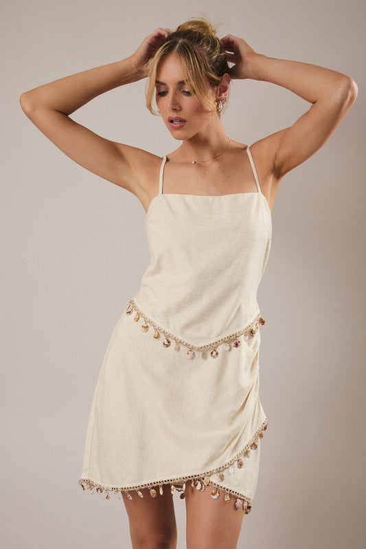 Boho coastal style mini dress with shell detailing and linen blend fabric