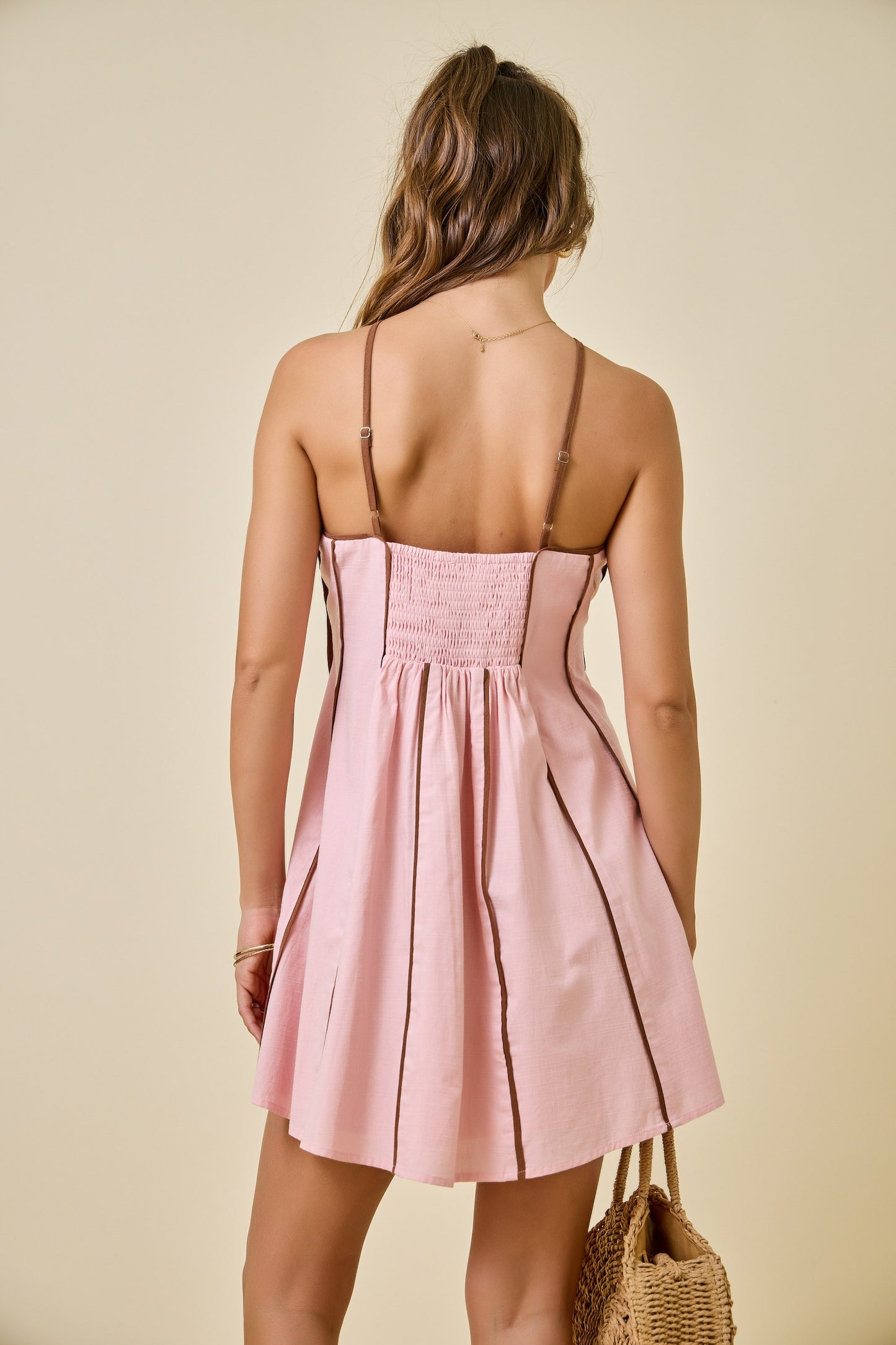 pink halter dress with brown vertical stripes
