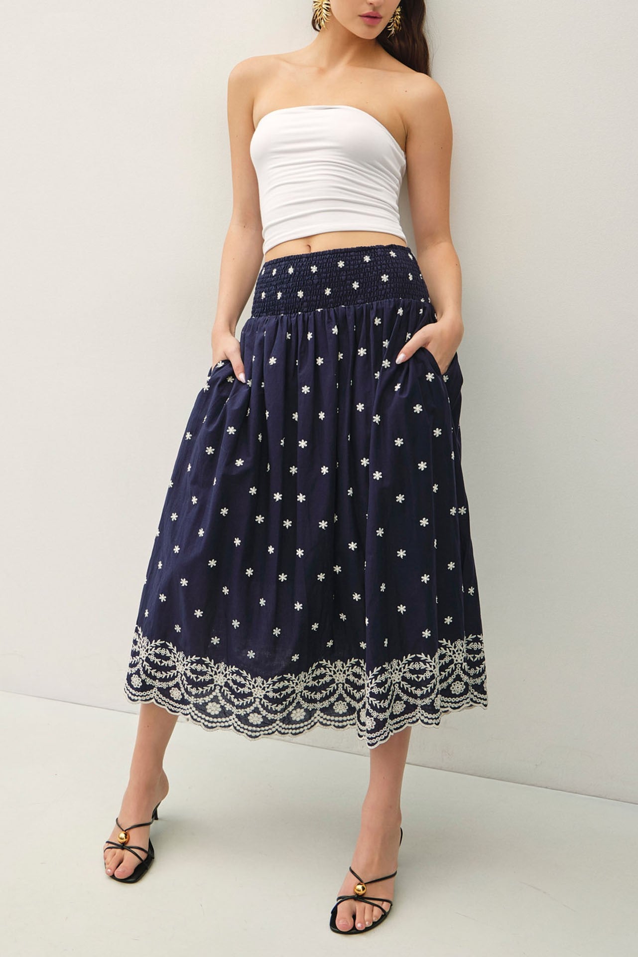 embroidered midi skirt with a scalloped hem and flowy high-waist silhouette