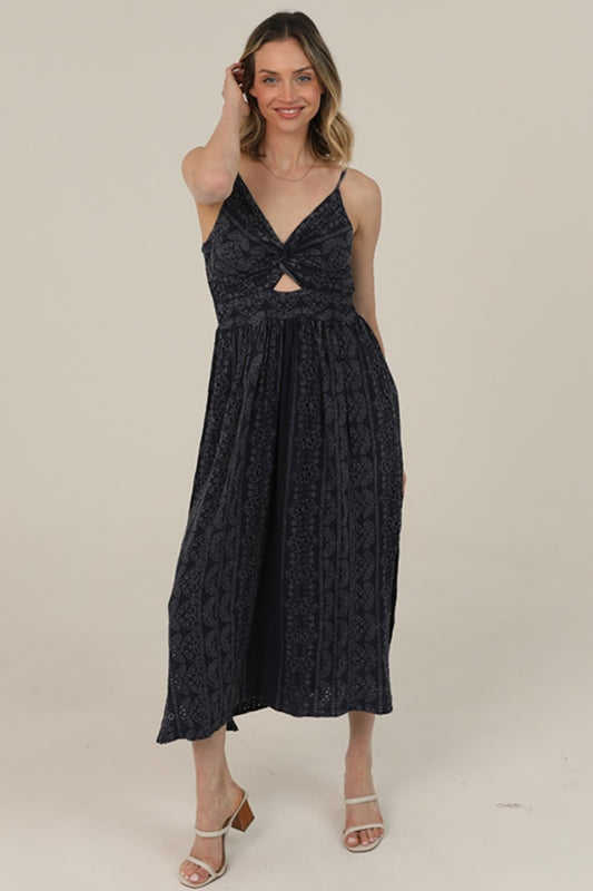Midi Dress features a twist-front bodice, cutout detail, and eyelet embroidery