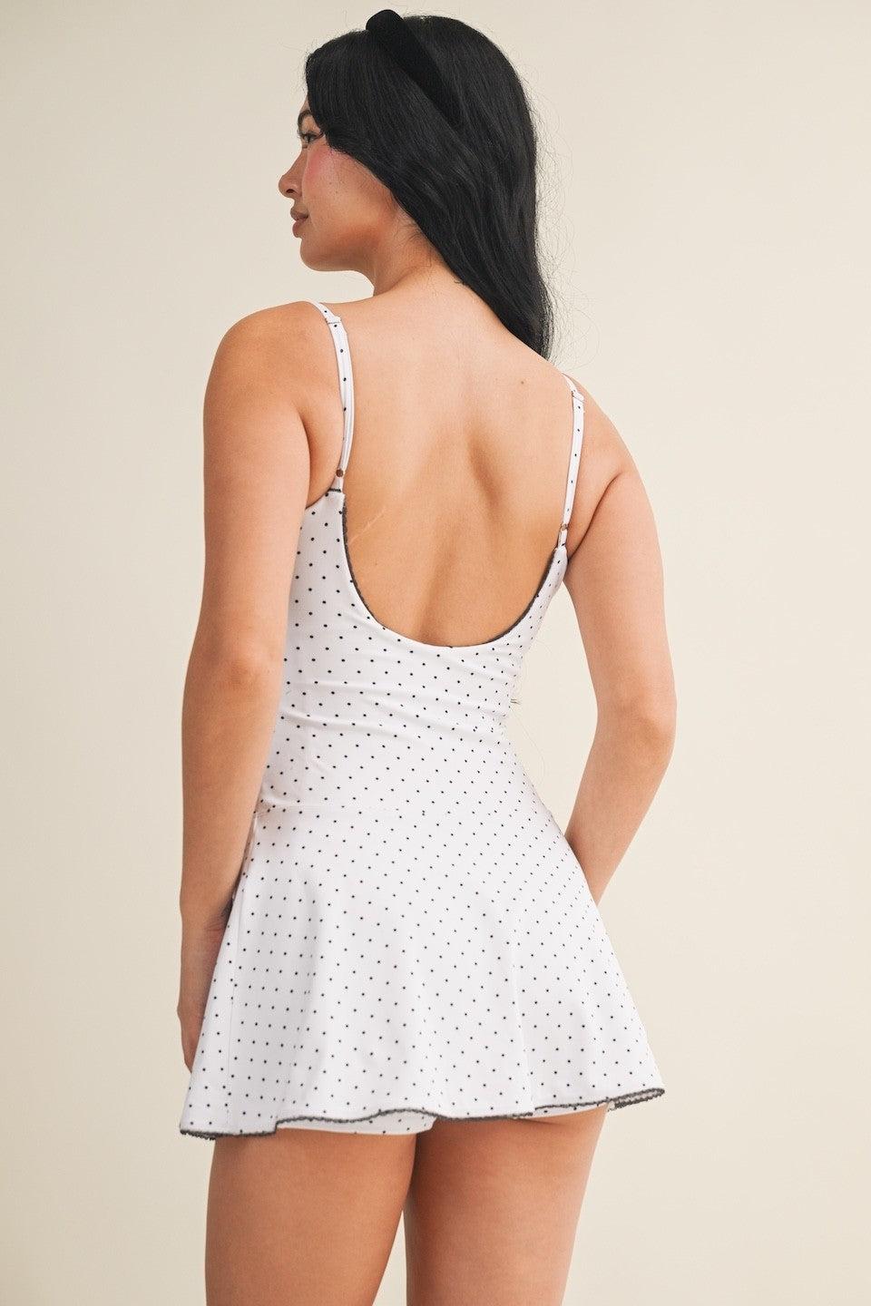 polka dot mini dress with lace trim, ruffle detailing, and a soft stretch fit