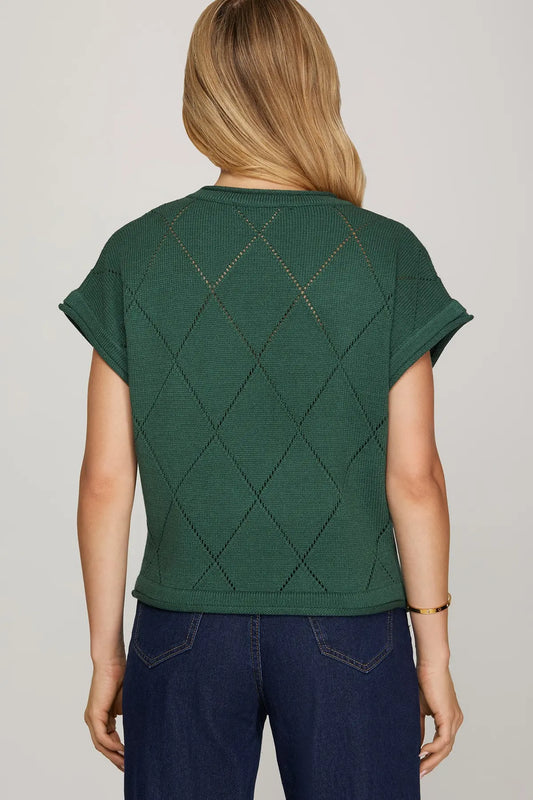 The Emera Checked Bow Sweater Top brings playful charm with a chic bow detail and timeless check pattern.