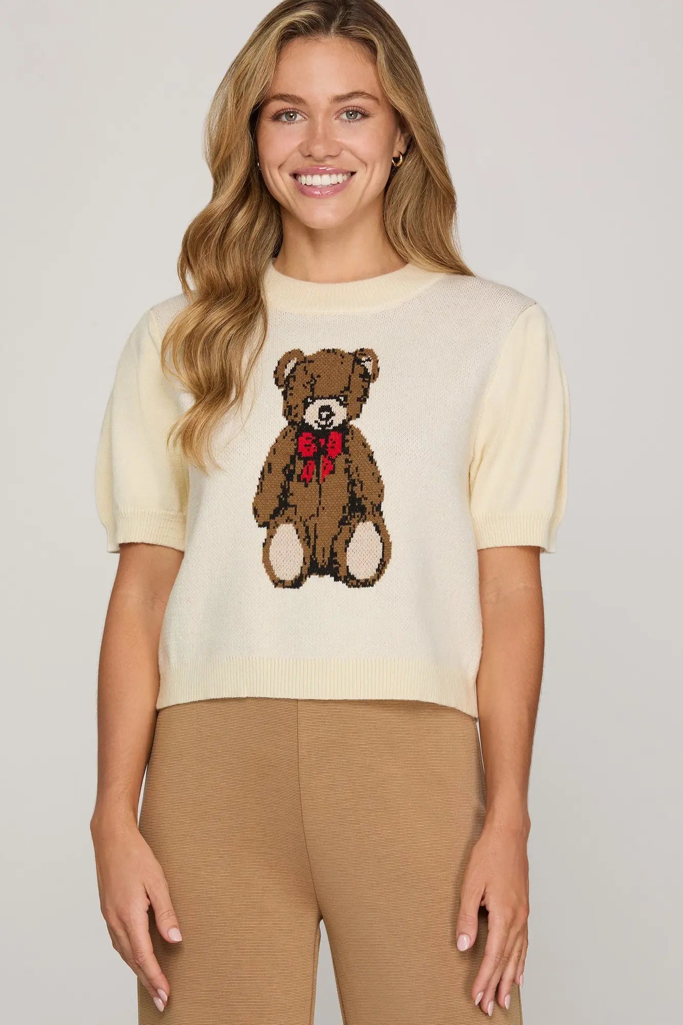 The Meredith Teddy Sweater Top brings cozy charm to your everyday style.