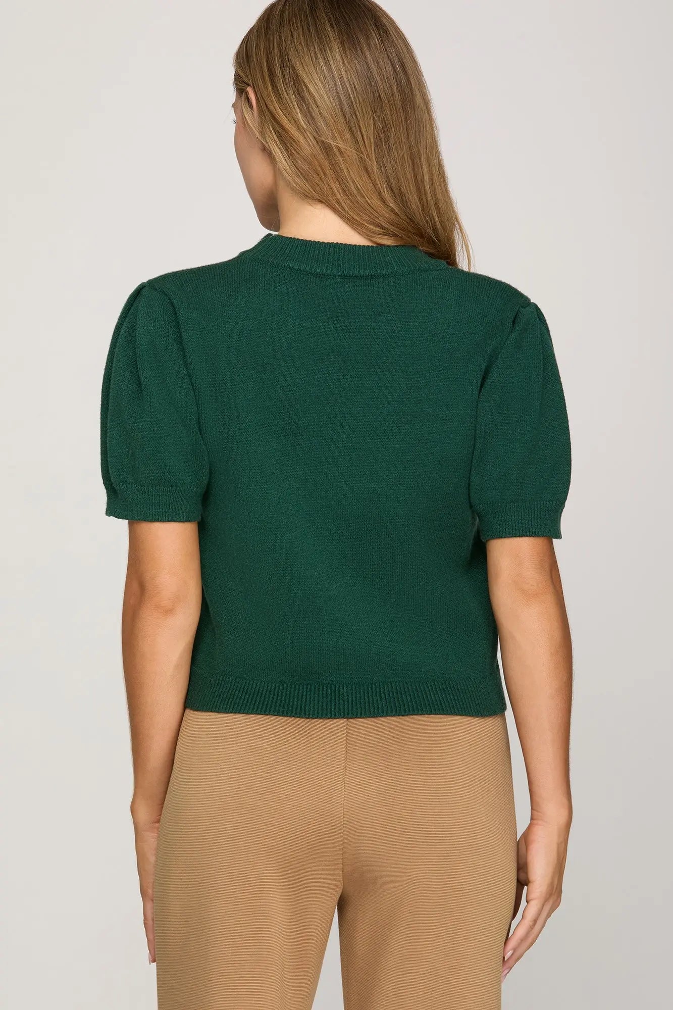 The Meredith Teddy Sweater Top brings cozy charm to your everyday style.