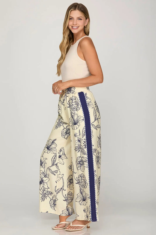 Woven print pants with contrast trim, elastic waistband, and pockets