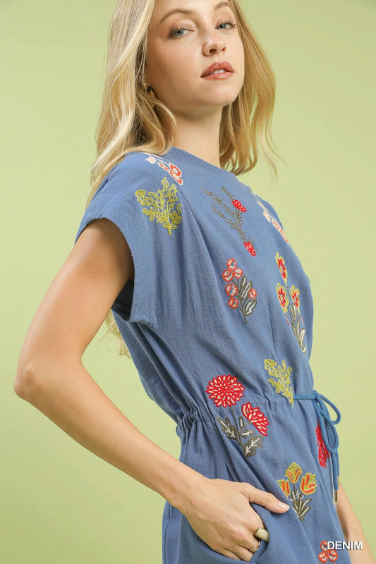 The Calista Embroidered Cotton Dress blends vibrant floral detailing with breezy comfort for effortless everyday elegance.