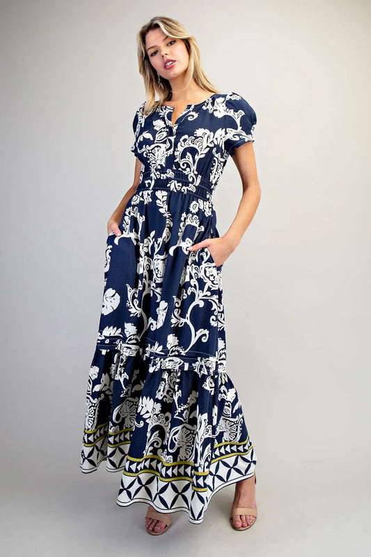 Printed maxi dress with puff sleeves and geometric border hem