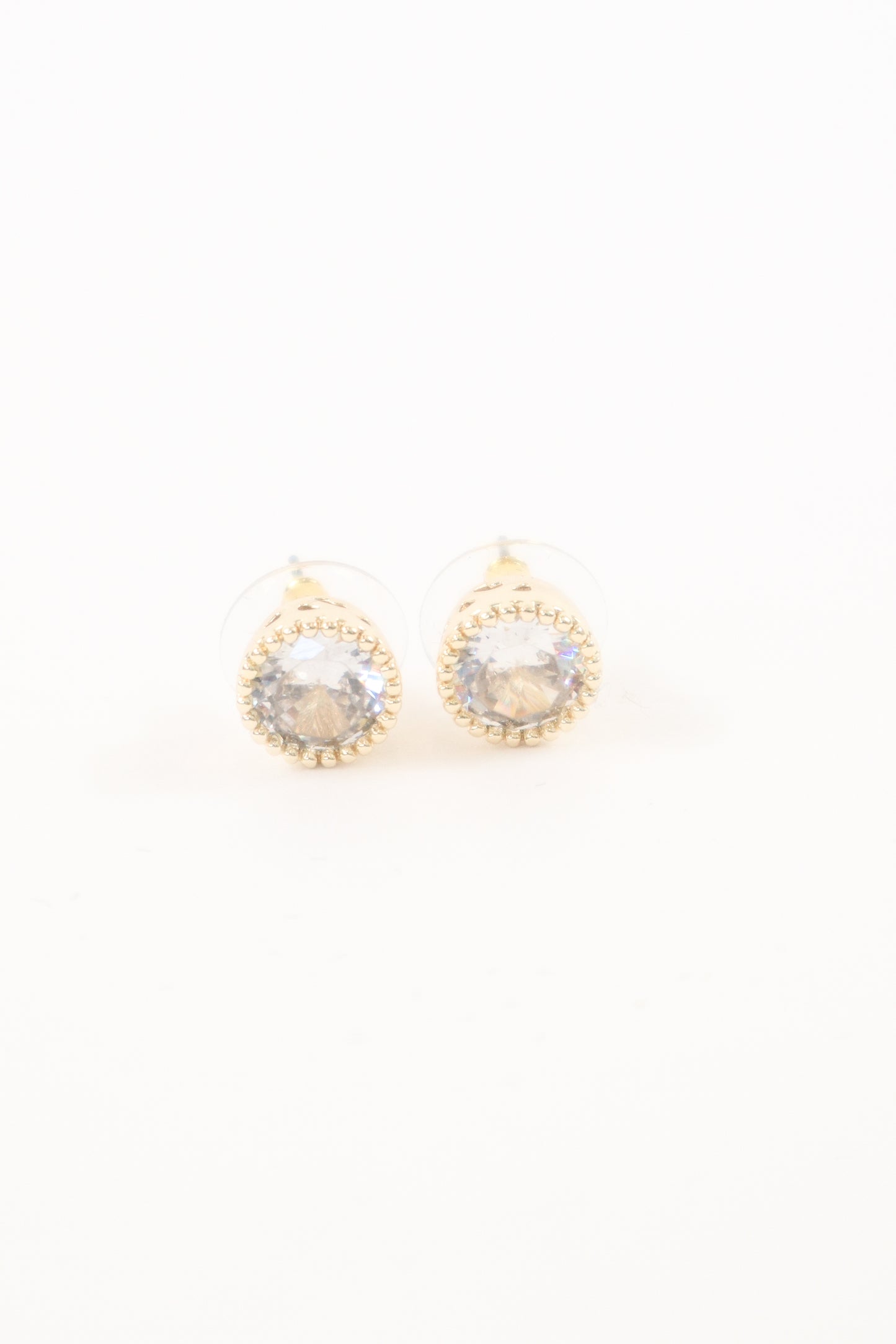 Gold round stud earrings with clear faceted crystal center and beaded trim