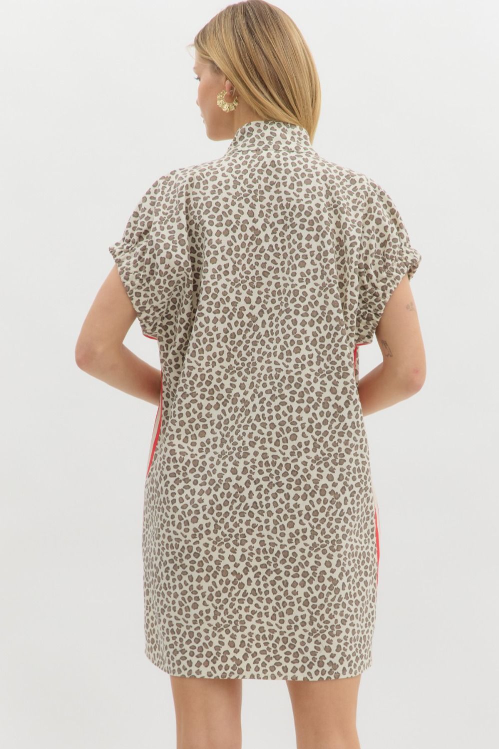 A bold leopard print mini dress with multicolor accents and a breezy, flattering silhouette.