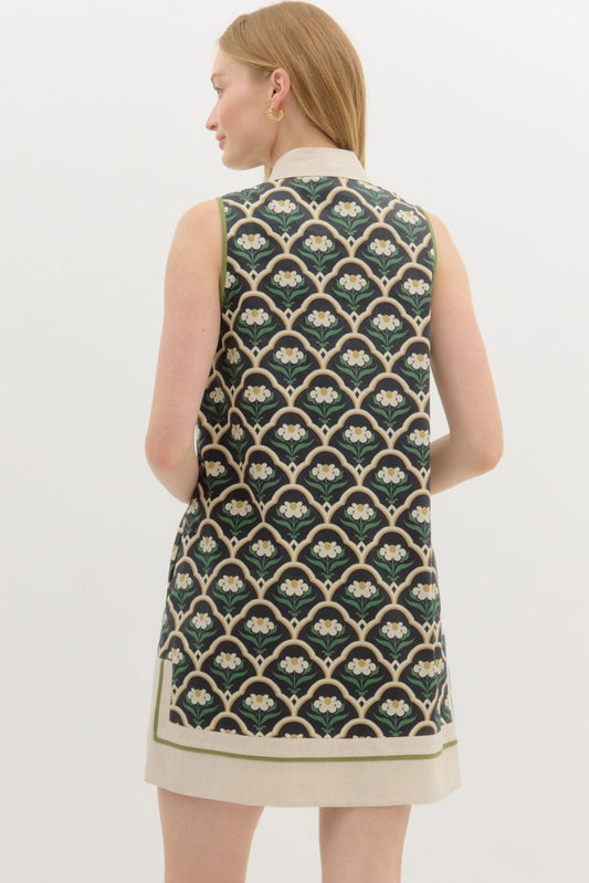 A breezy floral mini dress with scalloped motifs and caftan-inspired charm.