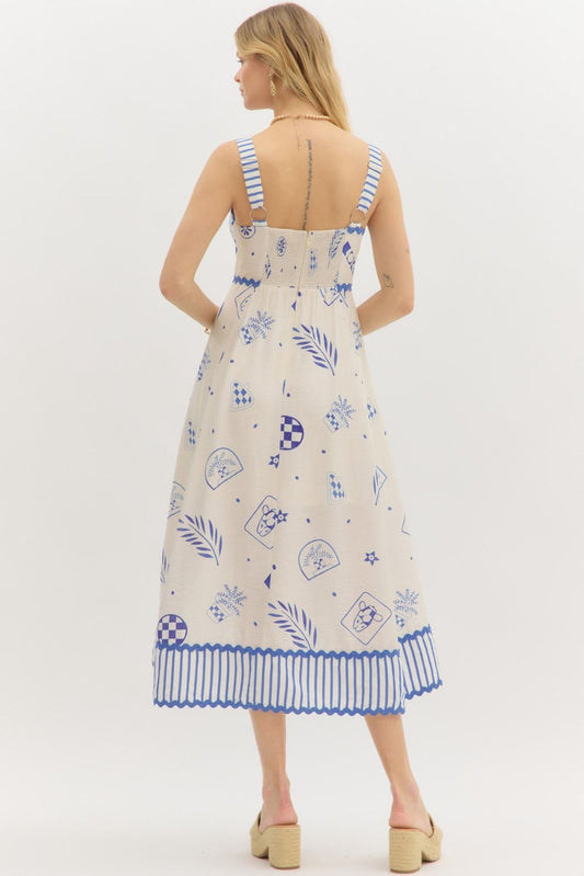 A chic multi-print midi dress with adjustable striped straps and a ricrac-accented hem for a playful finish.