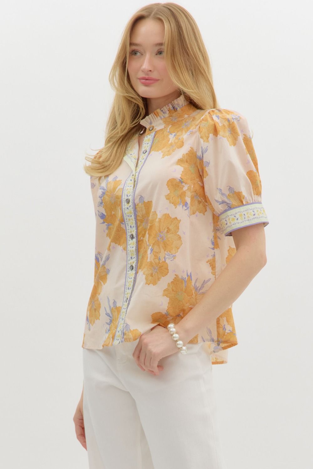 A delicate, floral print top that brings a touch of femininity and comfort to any outfit.