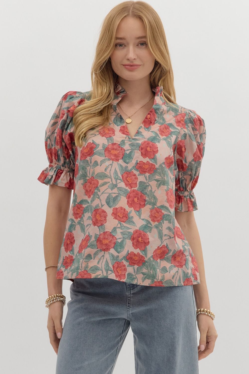 A floral puff sleeve pullover top with a pleated ruffle V-neck and band collar.