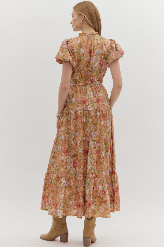 A floral puff sleeve tiered midi dress with an easy pullover fit and double elastic waist.