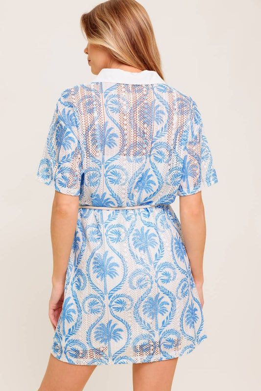 A lace mini dress with a collared neckline, button-down front, and rope belt for chic summer layering.
