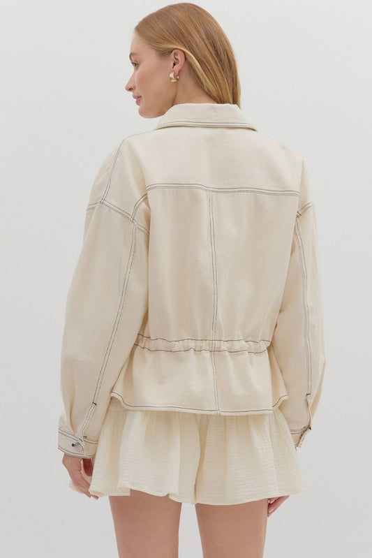 A lightweight woven utility jacket with a cinchable drawstring waist for easy, flattering layering.