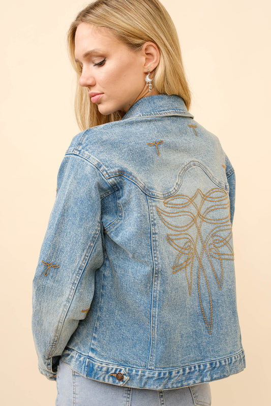 A rugged, boot-stitched denim trucker jacket with a relaxed, layer-ready fit.