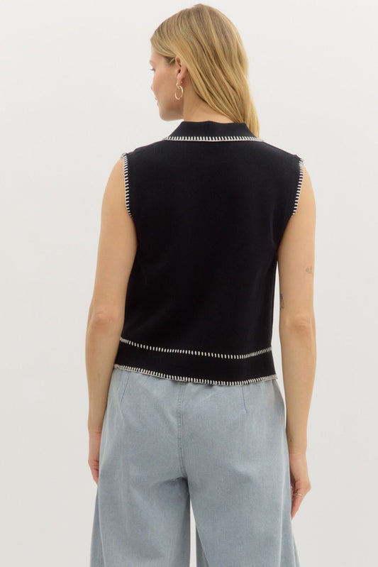 A sleeveless sweater knit top with a button front and unique blanket stitch collar—cozy meets polished in this elevated essential.