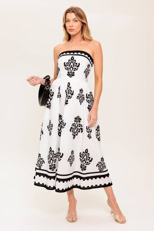 A strapless printed midi dress with a smocked back and flowing full skirt for a flattering, breezy look.