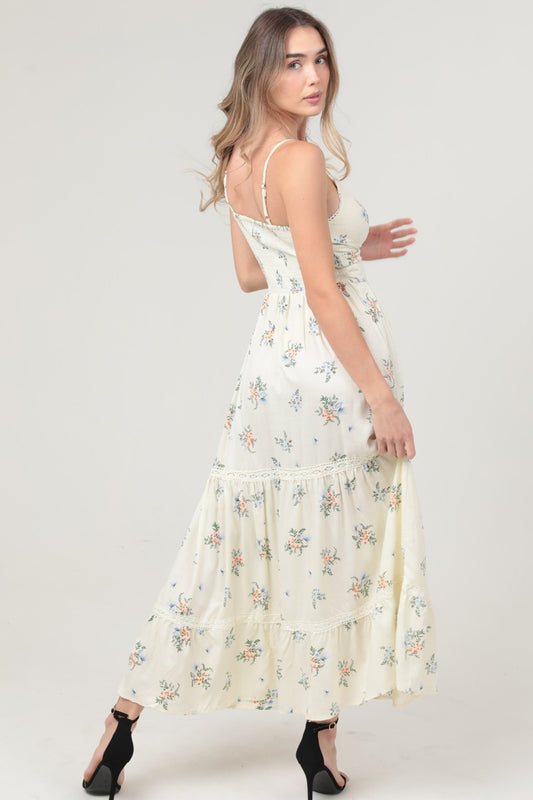 A stunning V-neck maxi dress with a twist-front bodice and daring cut-out detail for effortless allure.