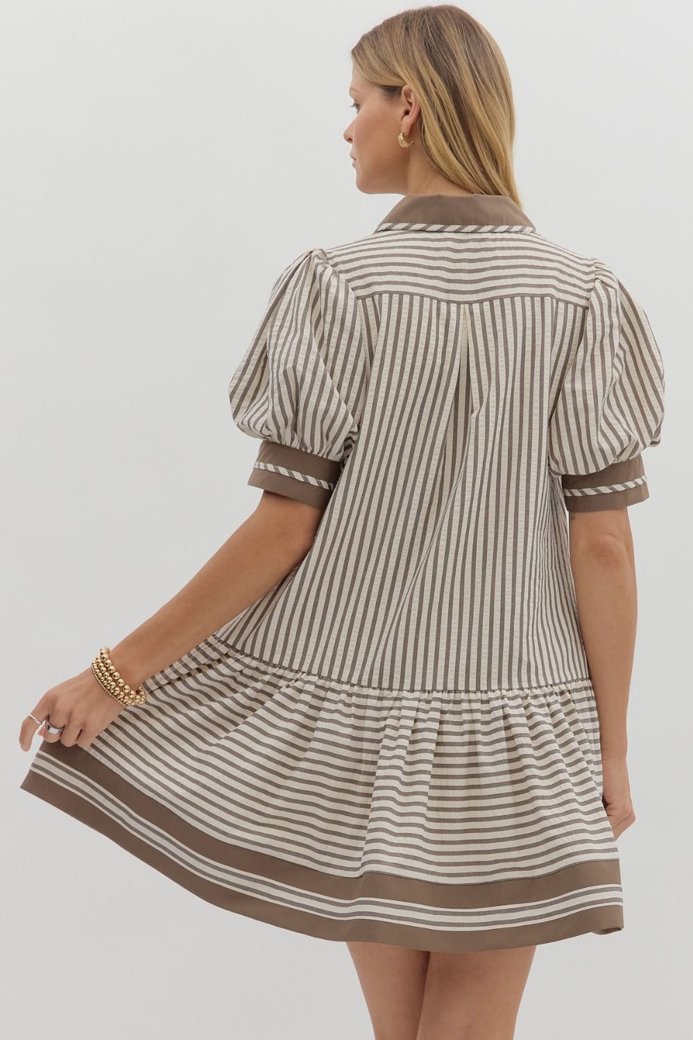 A textured stripe puff sleeve mini dress with a contrasting spread collar and handy side pockets.