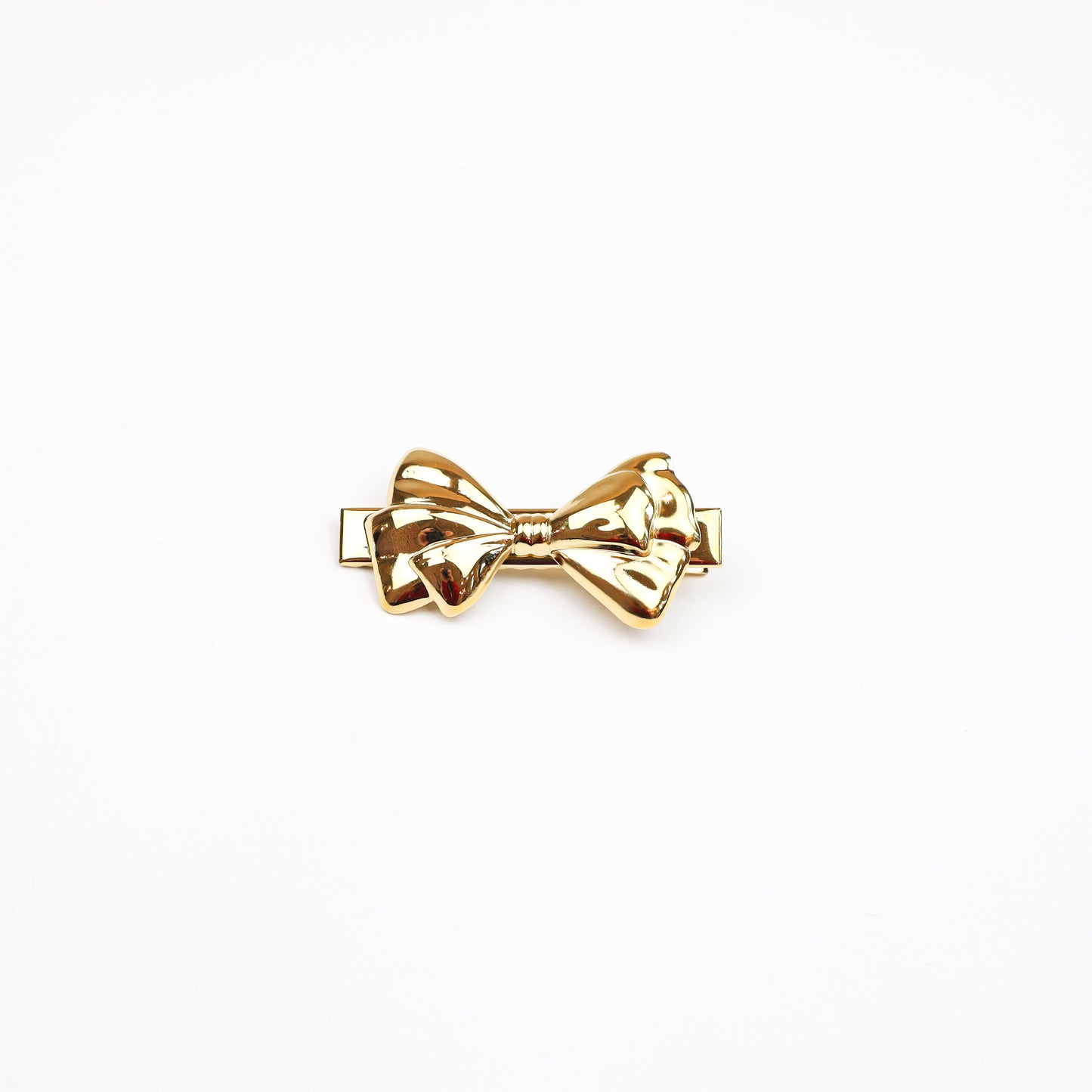 Elegant gold bow hair clip with a polished finish