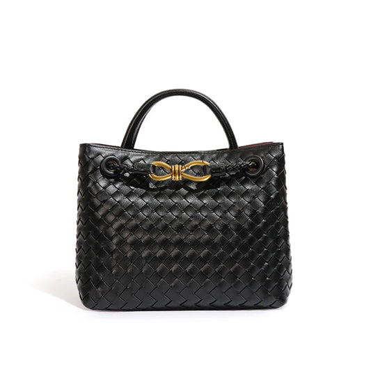 Elegant woven leather tote bag with gold-tone bow hardware and structured handles