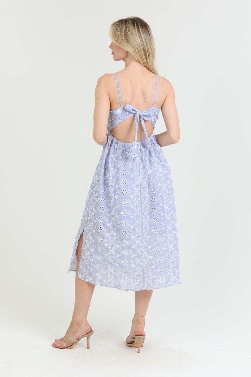 light blue eyelet midi dress with a deep V-neck and tie-back detail