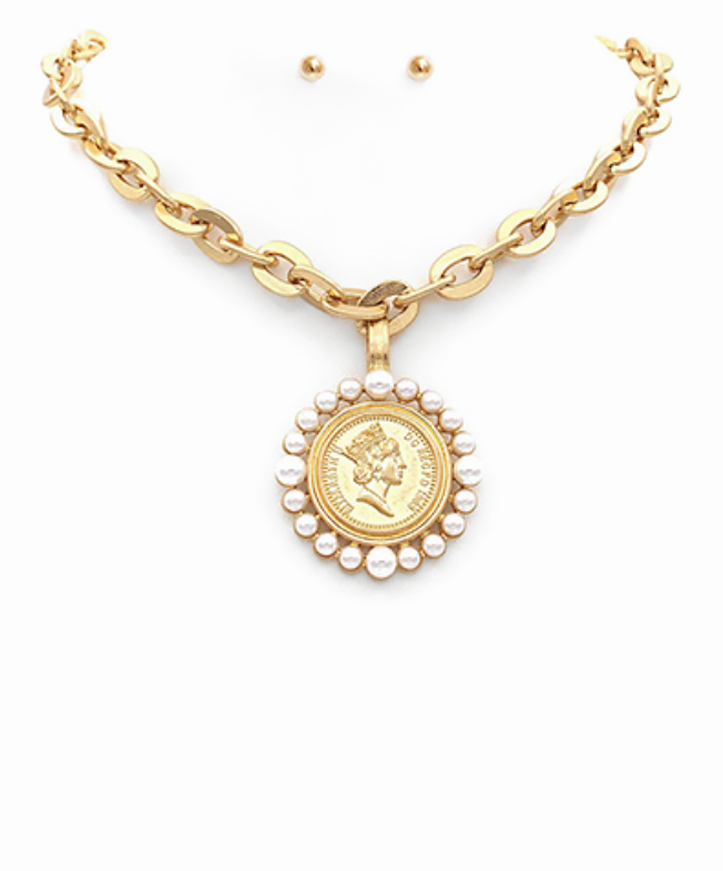 Gold chain necklace with a royal coin pendant encircled by pearls, featuring a toggle clasp for a bold yet elegant statement