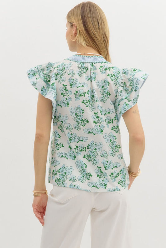 Floral print pullover top with contrast striped binding and tiered ruffle sleeves.