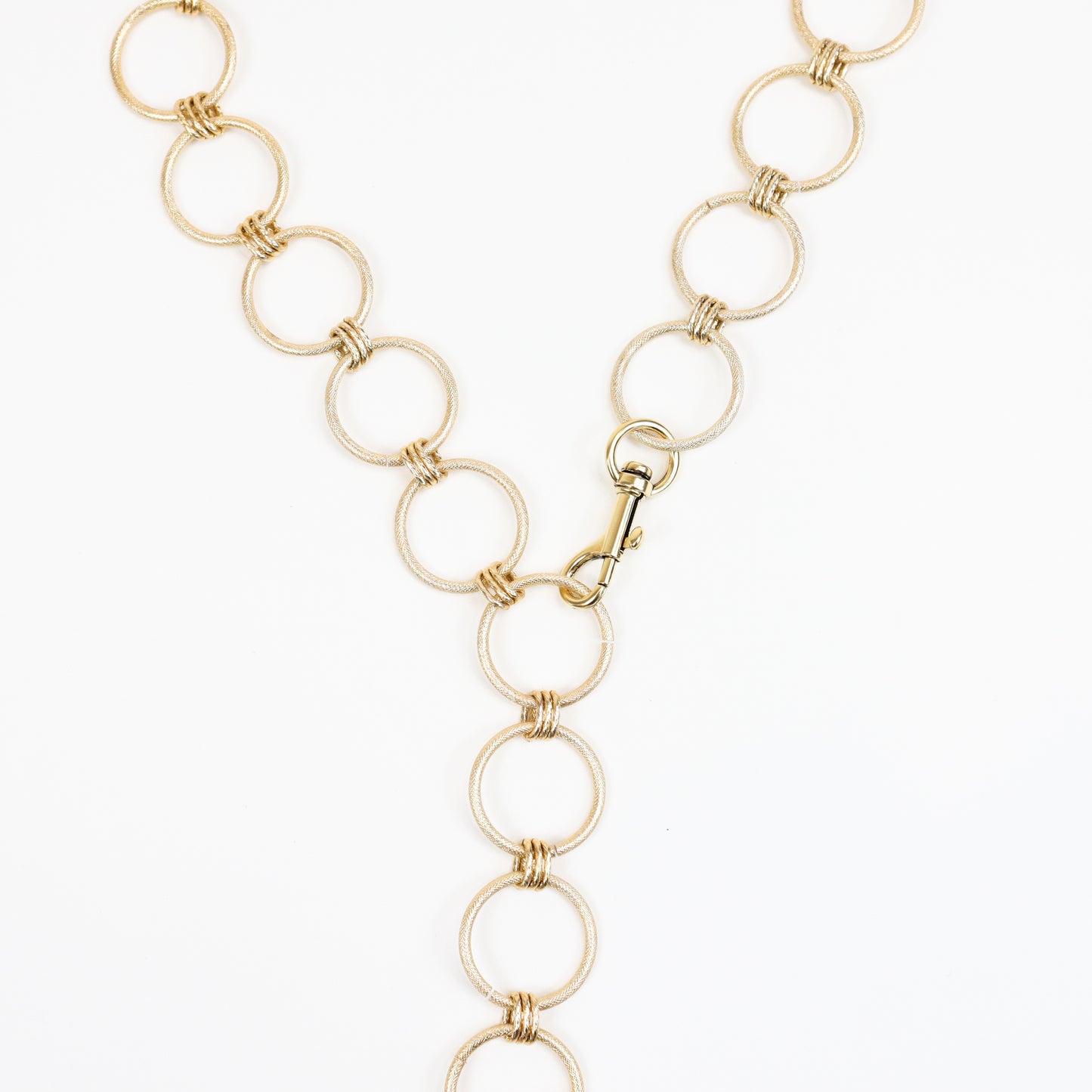 A handcrafted 22K gold-plated chunky chain featuring interlocking links, designed as a versatile convertible strap that can be worn as a belt, handbag chain, or statement necklace.