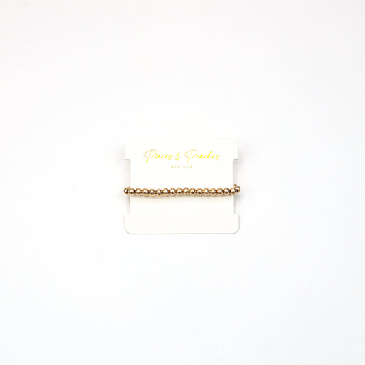 Gold statement earrings featuring an intricate textured design with a blend of brushed and polished finishes, offering a modern and elegant look