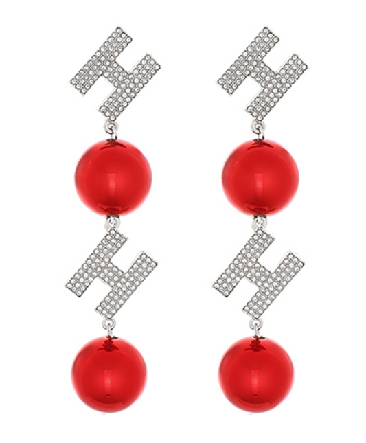 Christmas-inspired Ho-Ho-Holiday Cheer Earrings featuring red balls and sparkling cubic zirconia ‘Ho’ letters in gold-tone and silver-tone finishes.