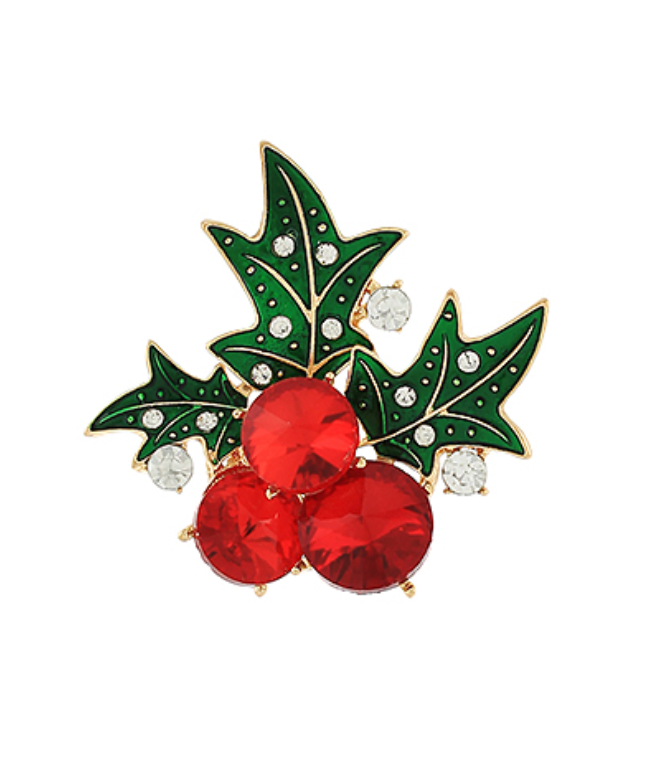 Close-up of a festive Holiday Holly Brooch with green enamel leaves and red crystal berries, perfect for Christmas celebrations.