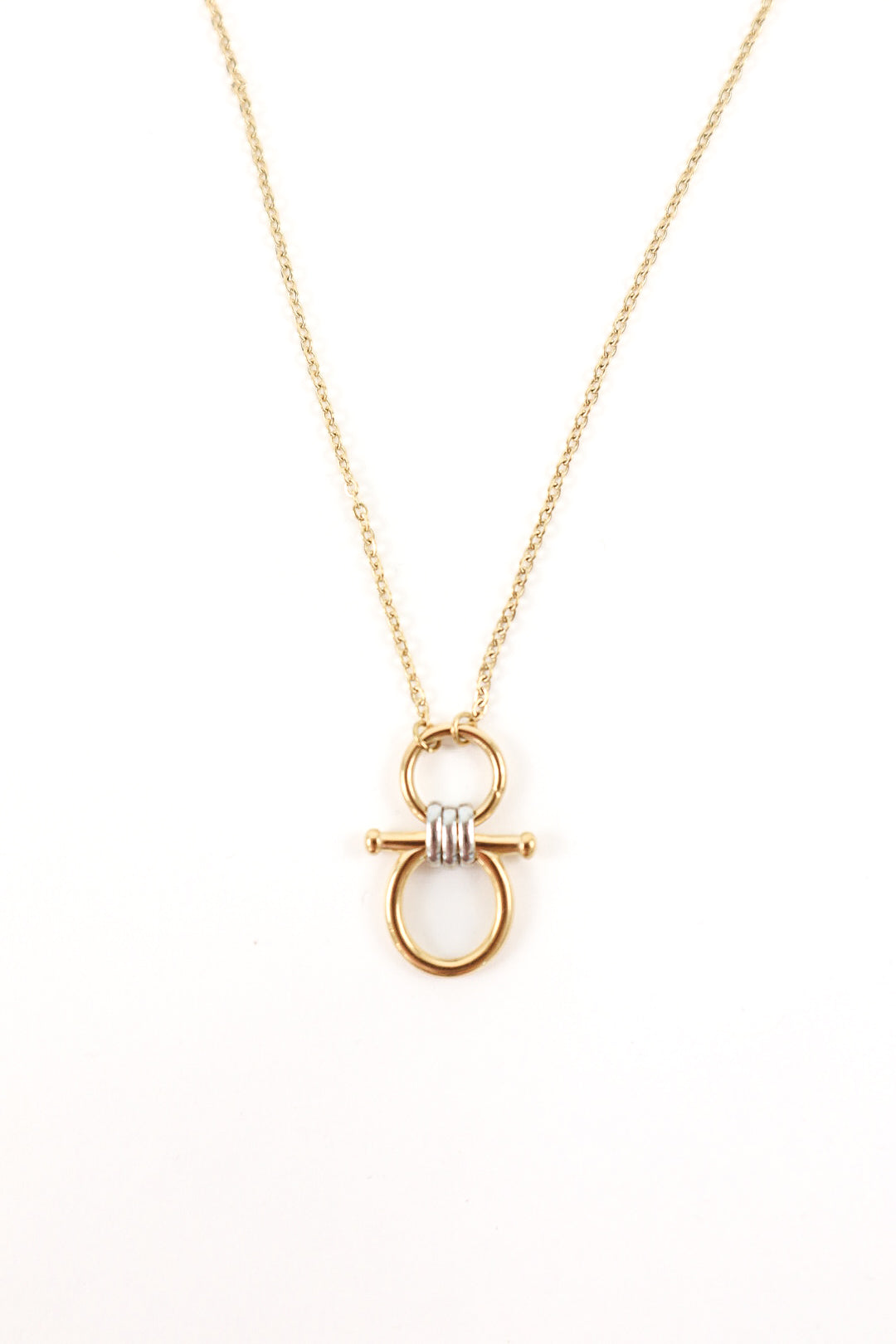 Gold pendant necklace featuring interlocking rings with a knot detail and delicate chain