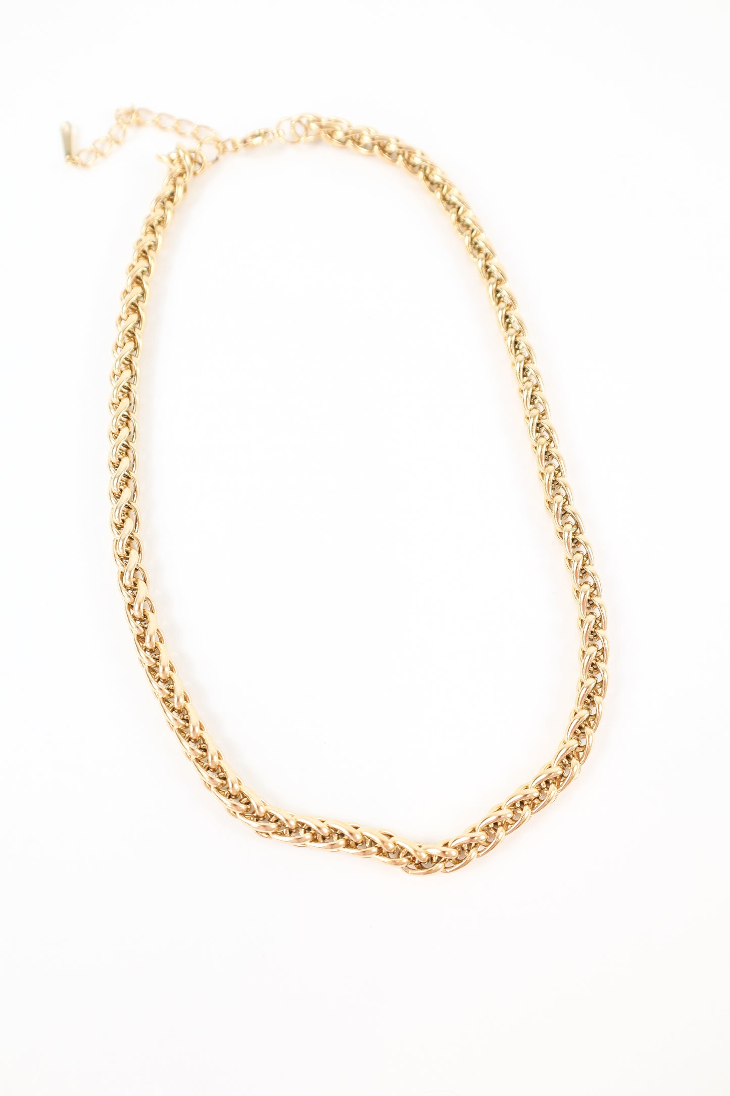 Chunky gold chain necklace with woven link design