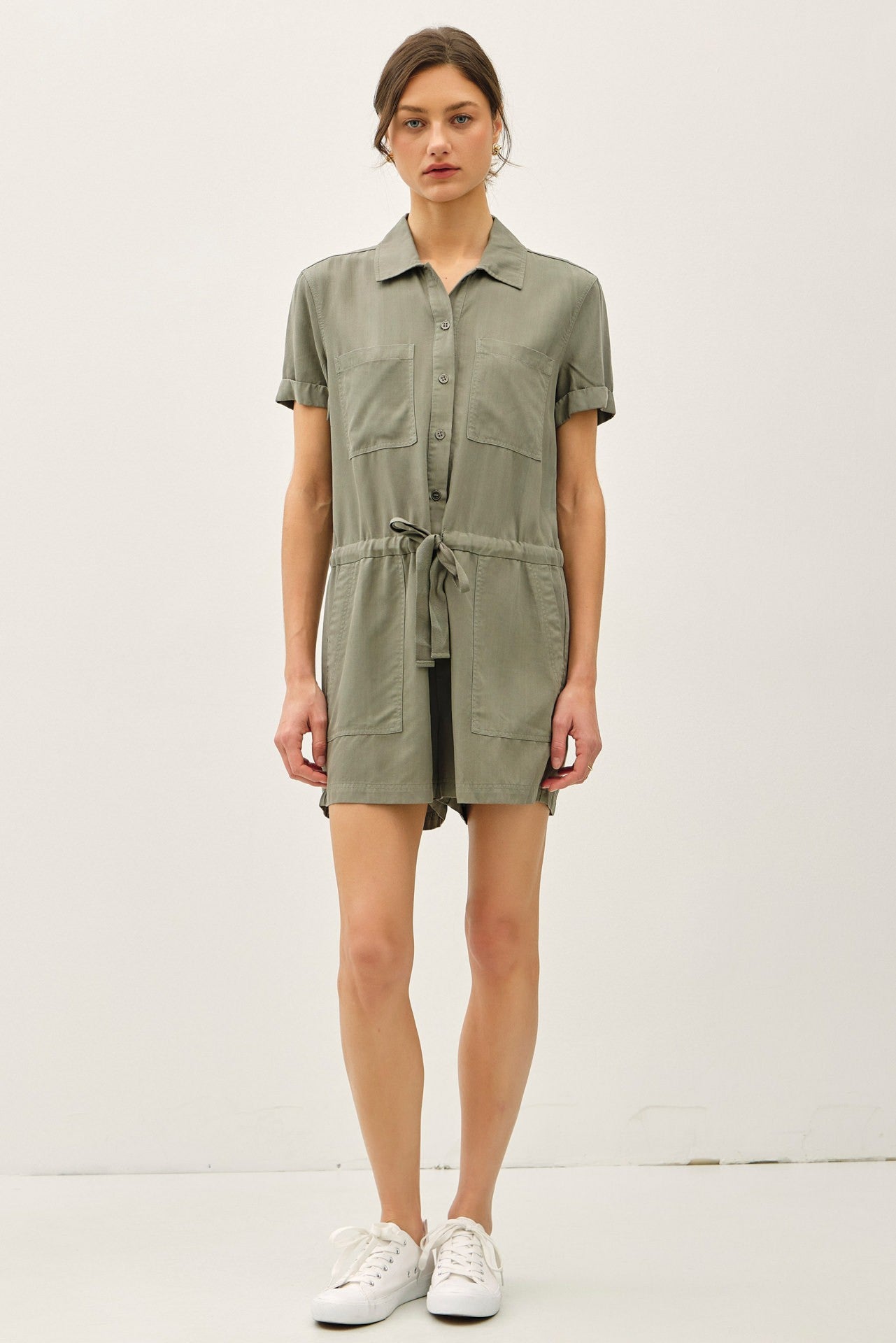 Lightweight Tencel romper with roll-cuff sleeves, drawstring waist, and effortless polish.