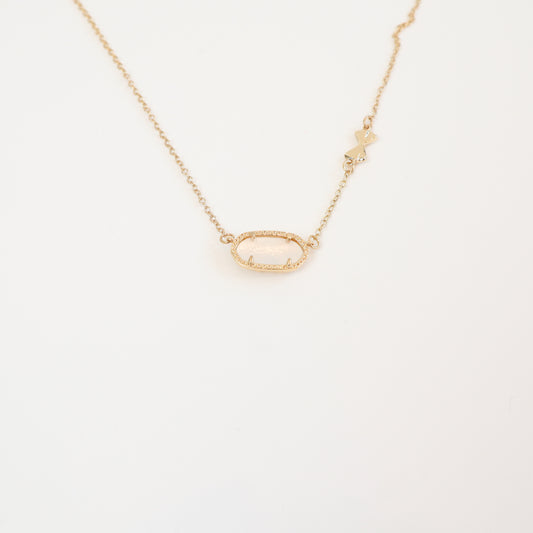 The reverse side of the Love Elise necklace, showcasing an intricate bow-accented openwork design for an alternative styling option.