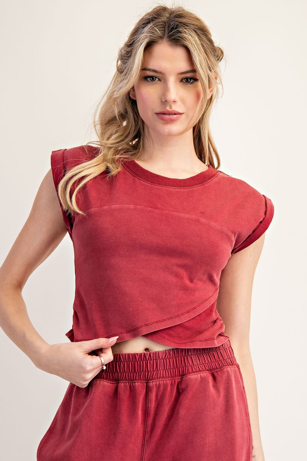 Mineral washed cropped wrap top with ruched side detail and cap sleeves.